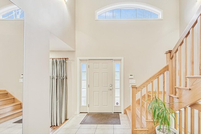 2020 Techny Rd, Northbrook, IL 60062 - foyer featuring stairs, a high ceiling, and light tile patterned floors