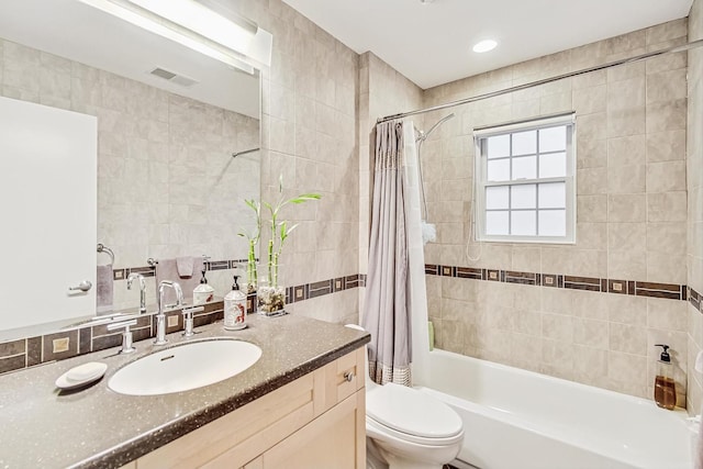 2020 Techny Rd, Northbrook, IL 60062 - bathroom featuring toilet, shower / bath combo with shower curtain, tile walls, visible vents, and vanity
