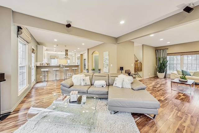2020 Techny Rd, Northbrook, IL 60062 - living area with light wood finished floors, baseboards, arched walkways, and recessed lighting