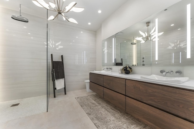 333 N Canal St Unit 3401, Chicago, IL 60606 - bathroom featuring a chandelier, double vanity, walk in shower, and tile patterned flooring