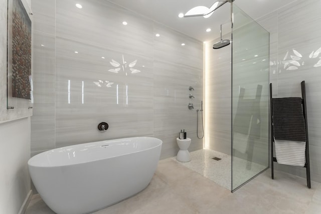 333 N Canal St Unit 3401, Chicago, IL 60606 - full bath featuring a freestanding tub, walk in shower, tile walls, and tile patterned floors