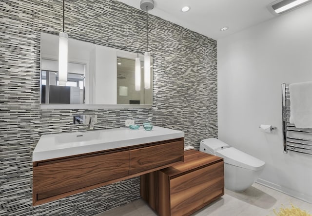 333 N Canal St Unit 3401, Chicago, IL 60606 - bathroom featuring radiator heating unit, toilet, tile walls, vanity, and recessed lighting