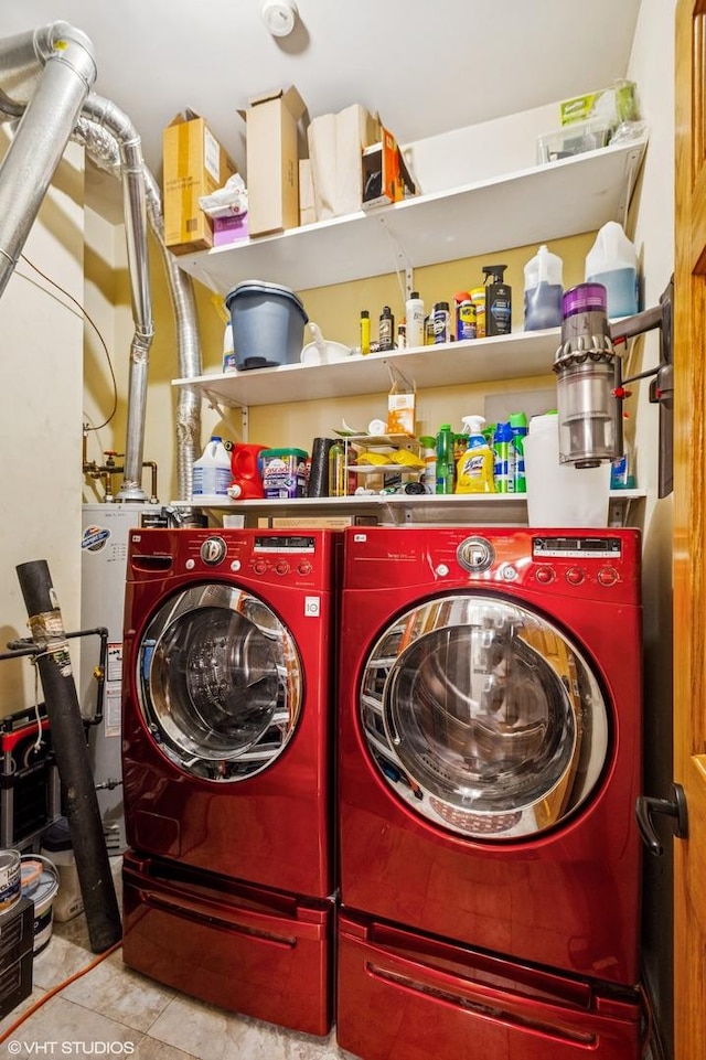 laundry area featuring washing machine and clothes dryer and water heater