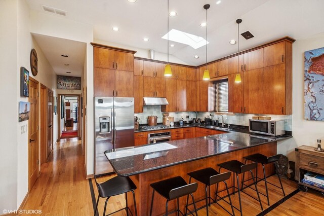dining area featuring light wood-style flooring and french doors