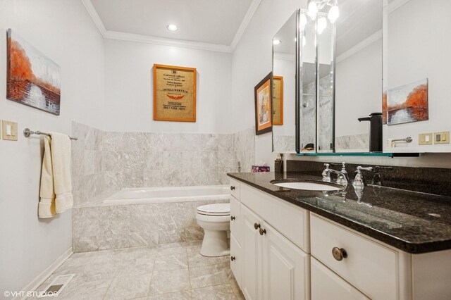 bathroom featuring ornamental molding, a garden tub, vanity, toilet, and baseboards
