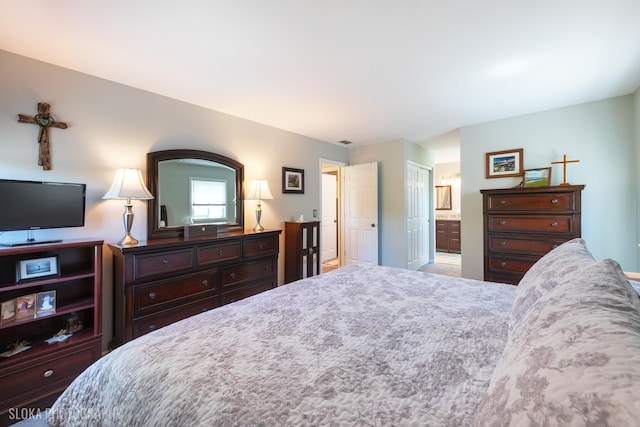 bedroom featuring connected bathroom