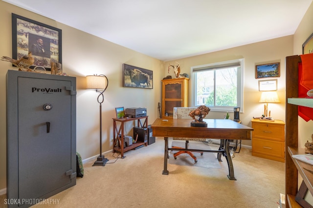 home office featuring light carpet and baseboards