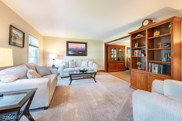 living area with light colored carpet