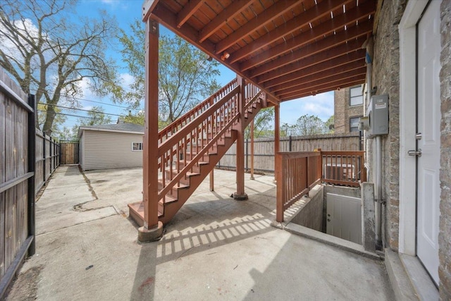 view of patio / terrace with stairway and a fenced backyard