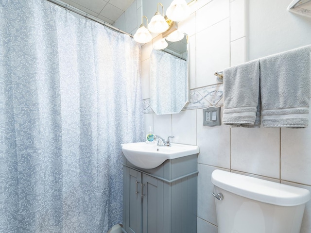 2504 W St, River Grove, IL 60171 - bathroom with vanity, toilet, a shower with curtain, and tile walls