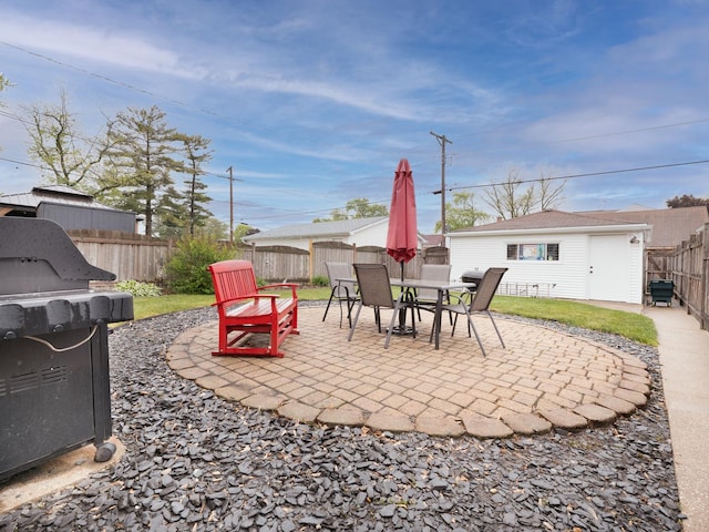2504 W St, River Grove, IL 60171 - fenced backyard featuring a patio area, an outbuilding, grilling area, and outdoor dining area