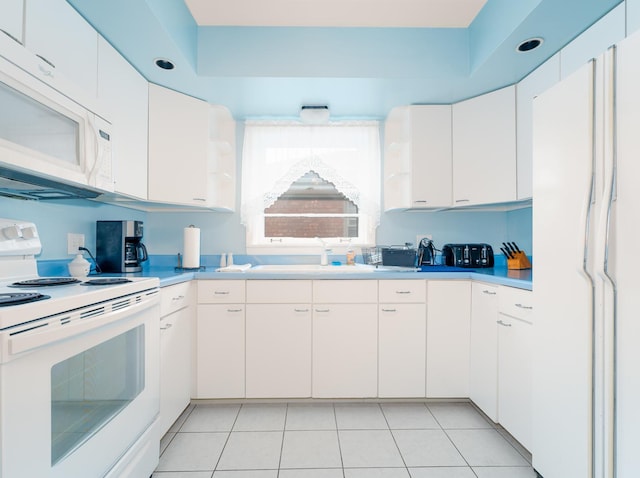 2504 W St, River Grove, IL 60171 - kitchen with white appliances, a sink, light countertops, and white cabinetry