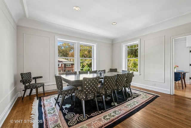 2472 W Estes Ave Unit 2, Chicago, IL 60645 - dining space with a decorative wall, wood finished floors, and a baseboard radiator