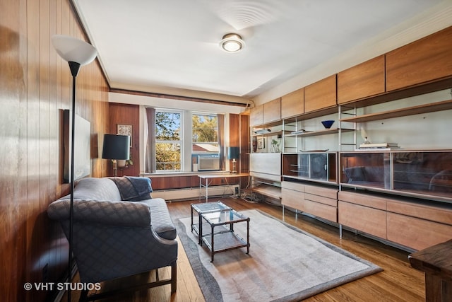 2472 W Estes Ave Unit 2, Chicago, IL 60645 - living room with baseboard heating, wood finished floors, and wooden walls