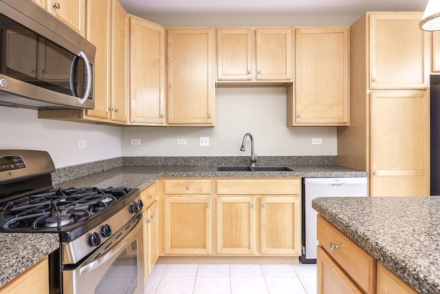 140 Tanglewood Dr, Glen Ellyn, IL 60137 - kitchen with stainless steel appliances, light brown cabinets, a sink, and light tile patterned floors