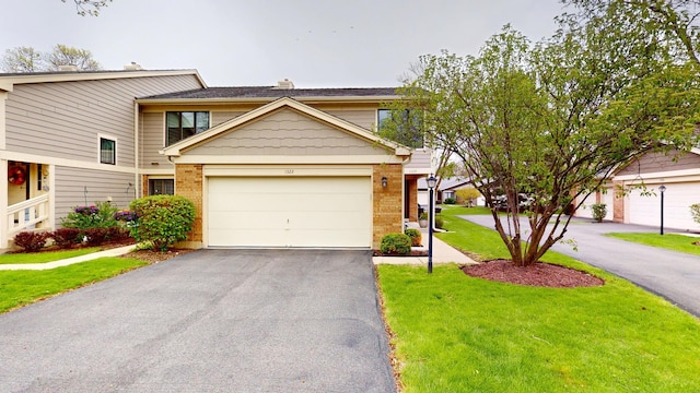 1322 Downs Pkwy, Libertyville, IL 60048 - view of front of property with driveway, brick siding, and a front lawn