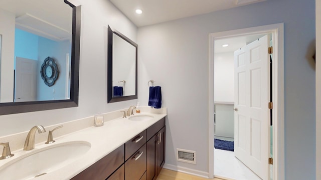 1322 Downs Pkwy, Libertyville, IL 60048 - full bathroom with double vanity, recessed lighting, and baseboards