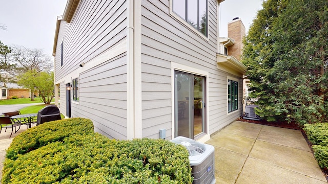 1322 Downs Pkwy, Libertyville, IL 60048 - view of side of property featuring a patio and central air condition unit