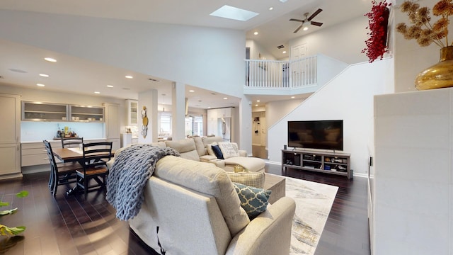 1322 Downs Pkwy, Libertyville, IL 60048 - living area with a skylight, dark wood finished floors, a ceiling fan, recessed lighting, and a towering ceiling