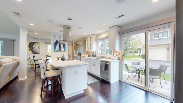 1322 Downs Pkwy, Libertyville, IL 60048 - kitchen featuring a sink, stainless steel dishwasher, glass insert cabinets, dark wood-type flooring, and a kitchen breakfast bar