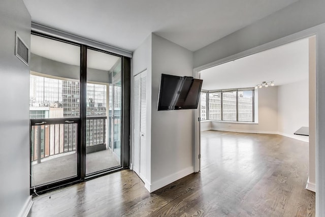 400 N Lasalle St Unit 2207, Chicago, IL 60654 - spare room featuring wood finished floors and baseboards