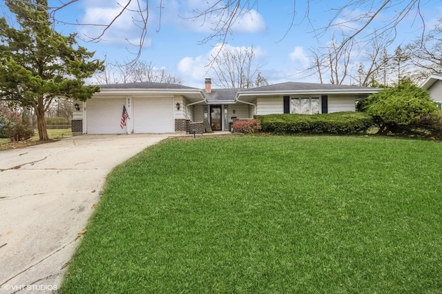 ranch-style home featuring a chimney, an attached garage, a front lawn, driveway, and brick siding