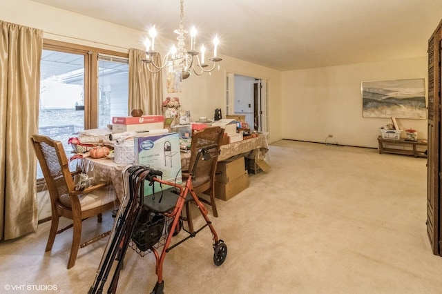 dining room featuring a chandelier and light colored carpet