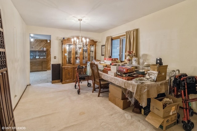 carpeted dining room featuring a chandelier and an office area