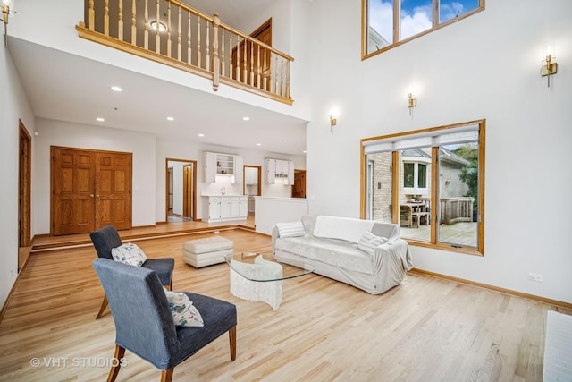 6245 Pine Tree Dr, Long Grove, IL 60047 - living area with light wood-type flooring, a high ceiling, recessed lighting, and baseboards