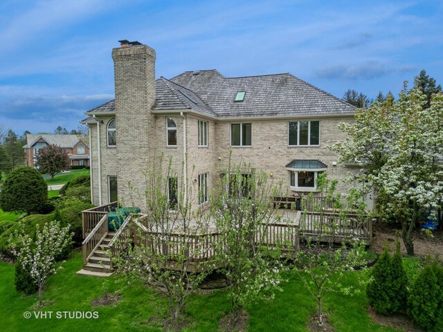 6245 Pine Tree Dr, Long Grove, IL 60047 - back of house with a chimney, brick siding, and a wooden deck