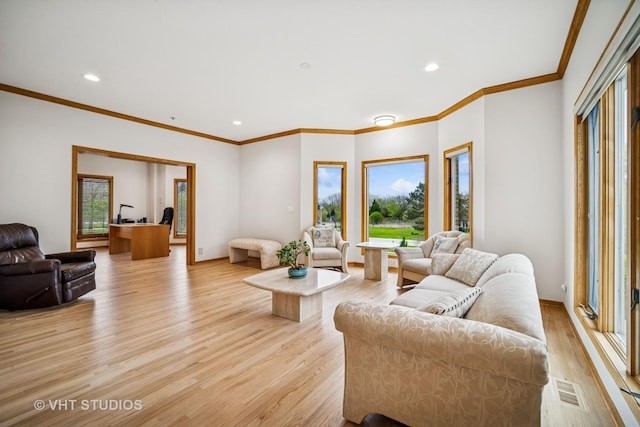 living room with light wood-style floors, recessed lighting, ornamental molding, and baseboards