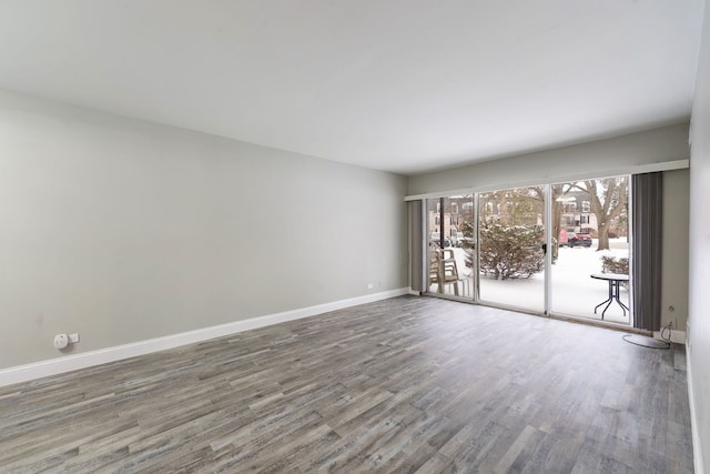 5300 Carriageway Dr Unit 102, Rolling Meadows, IL 60008 - unfurnished room featuring wood finished floors and baseboards