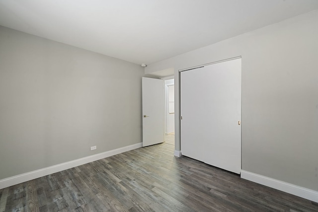 5300 Carriageway Dr Unit 102, Rolling Meadows, IL 60008 - unfurnished bedroom featuring baseboards and wood finished floors