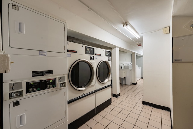 5300 Carriageway Dr Unit 102, Rolling Meadows, IL 60008 - shared laundry area with stacked washer and clothes dryer, washing machine and dryer, and light tile patterned flooring