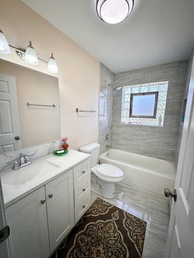 full bath with shower / bath combination, vanity, and toilet