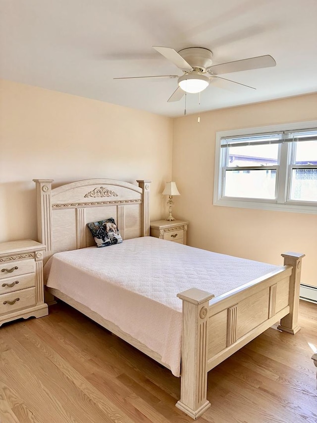 bedroom with wood finished floors and ceiling fan