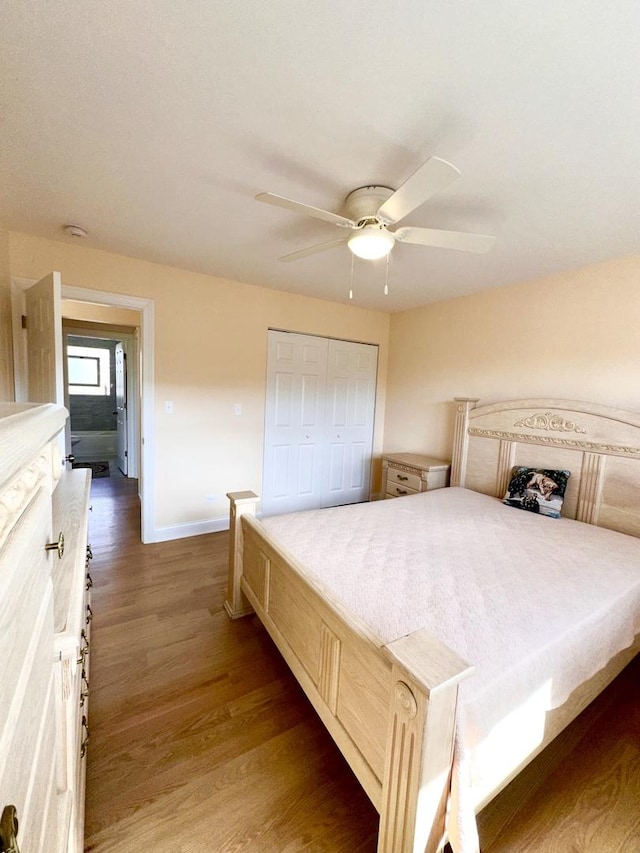 bedroom featuring wood finished floors, baseboards, a closet, and ceiling fan