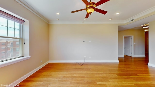 empty room featuring light wood-type flooring, crown molding, ceiling fan, baseboards, and recessed lighting