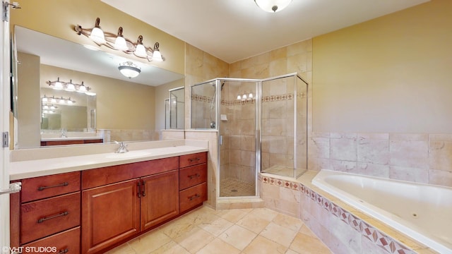 bathroom with a shower stall, a garden tub, and vanity