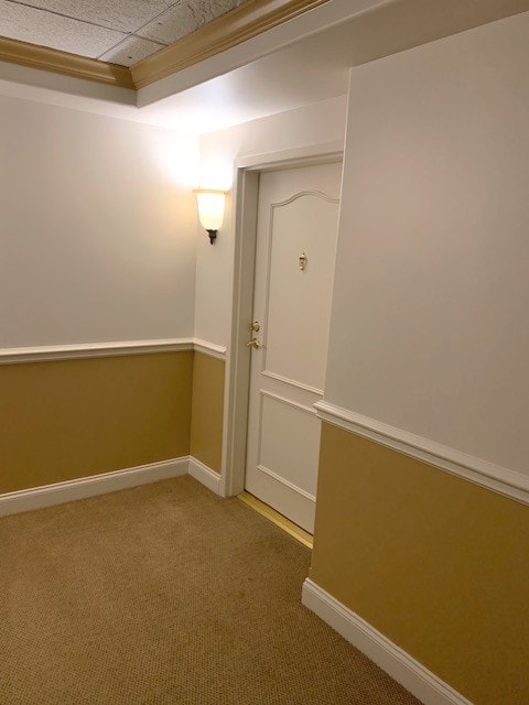 unfurnished room with carpet floors and baseboards