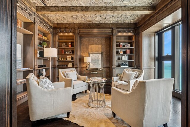 77 E Walton St Unit 25C, Chicago, IL 60611 - living area featuring built in features, wood finished floors, and beamed ceiling