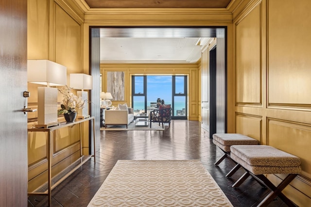 77 E Walton St Unit 25C, Chicago, IL 60611 - hallway with a decorative wall, ornamental molding, and dark wood-style flooring