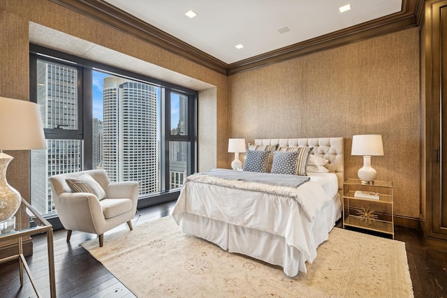 77 E Walton St Unit 25C, Chicago, IL 60611 - bedroom featuring hardwood / wood-style flooring, crown molding, a city view, and wallpapered walls