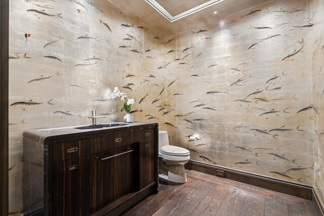 77 E Walton St Unit 25C, Chicago, IL 60611 - half bath featuring toilet, hardwood / wood-style floors, and vanity