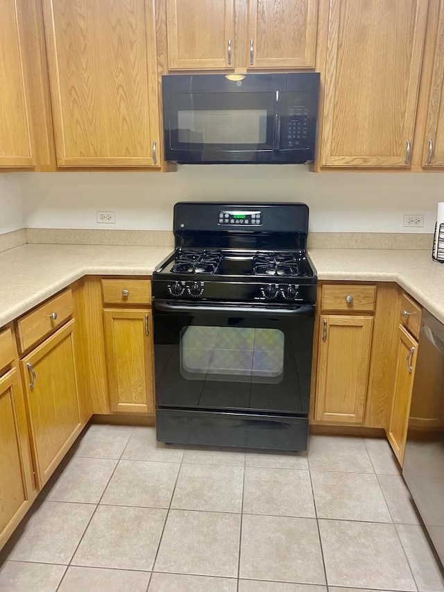 656 Pearson St Unit 608C, Des Plaines, IL 60016 - kitchen with black appliances, light tile patterned floors, and light countertops