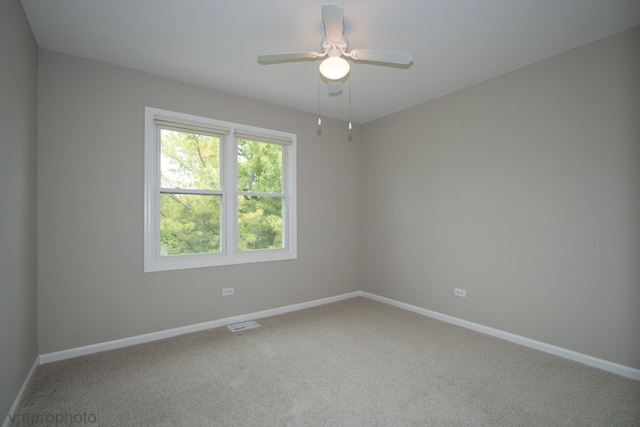 300 Hunters Cir, Fox River Grove, IL 60021 - unfurnished room featuring baseboards, carpet, and a ceiling fan