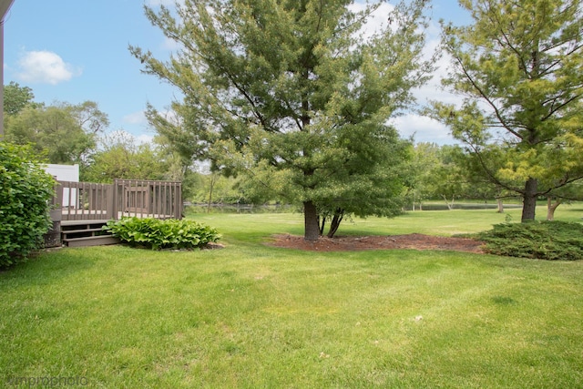 300 Hunters Cir, Fox River Grove, IL 60021 - view of green lawn with a wooden deck
