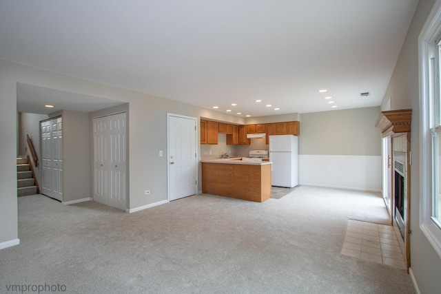 300 Hunters Cir, Fox River Grove, IL 60021 - unfurnished living room featuring light colored carpet, stairway, a fireplace, recessed lighting, and baseboards