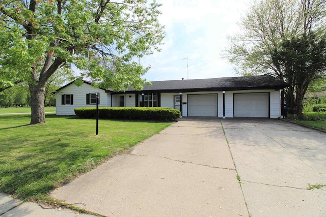 ranch-style house with a garage, a front yard, and driveway