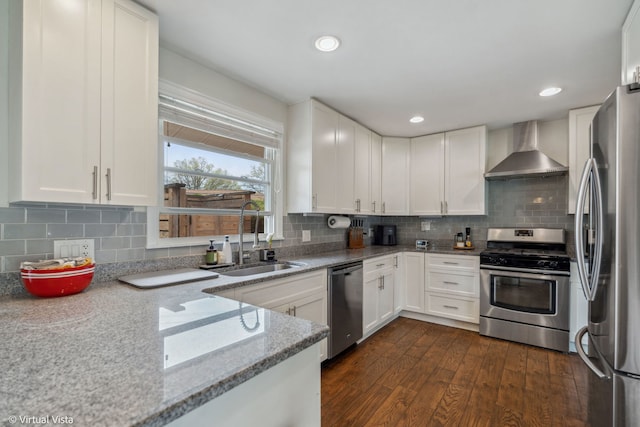 8139 W Bryn Mawr Ave, Norwood Park, IL 60631 - kitchen with wall chimney range hood, appliances with stainless steel finishes, a sink, light stone counters, and dark wood-style floors